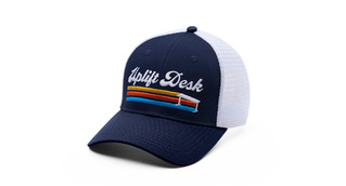 The mid-crown profile and mesh side and rear panels give a classic trucker feel to UPLIFT Desk Caps