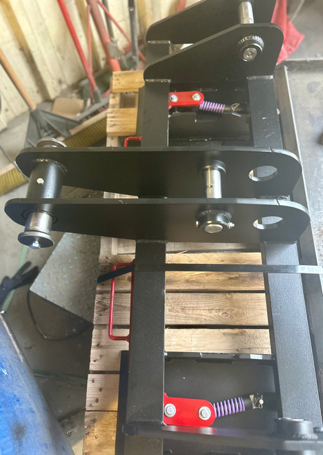 JD 210 LE Pin On to Quick Attach Skid Steer Attachment Adapter
This design keeps the face of thee latch boxes in line and keeps them from twisting and going out of alignment.
Latch box sides are 1/2" thick and are made from grade 50 plate for added strength.
The latching pins are designed so that when the latches are closed the springs are bottomed out so that the pins cannot come unlatched.