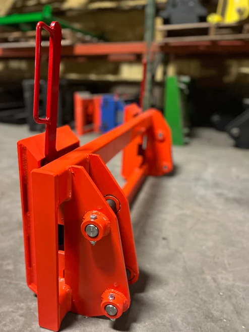 Converts a pin on Kubota 1251 to use standardized skid steer equipment. Heavy duty construction throughout.
Two crossbar design keeps the face of thee latch boxes in line and keeps them from twisting and going out of alignment.
Latch box sides are 3/8" thick and are made from grade 50 plate for added strength.