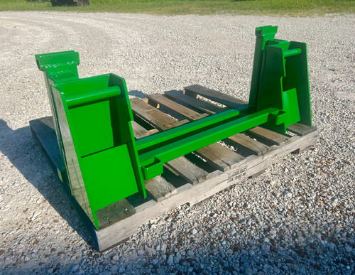 JD 240, 245, 260 & 265 to JD 600/700 conversion
Two crossbar design keeps the face of thee latch boxes in line and keeps them from twisting and going out of alignment.
Latch box sides are 1/2" thick and are made from grade 50 plate for added strength.
The latching pins are designed so that when the latches are closed the springs are bottomed out so that the pins cannot come unlatched.
Bushing for pins
Grease Zerk in both latching pin tubes
Couples the two different Quick hitches as close as is physically possible for maintaining maximum lifting capacity.
Quick attach adapters are also available for tractor loaders with pin on buckets to convert them to quick attach.
