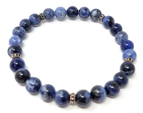 Elegant sodalite beaded bracelet featuring real blue gemstones and 925 sterling silver charms for both men and women.