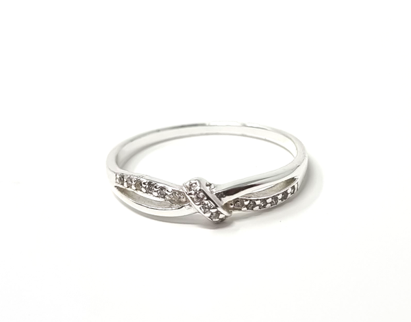 This stunning sterling silver knot ring adorned with sparkling cubic zirconia diamonds is the perfect gift for that special someone in your life.
