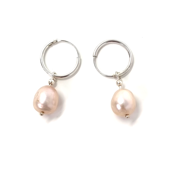 Enhance your style with these exquisite 925 Sterling Silver Hoop Earrings, delicately beaded with lustrous Freshwater Pearls. Perfect for any occasion, these elegant accessories will add a touch of sophistication to your look.