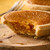 Close-up of Lottie Shaw’s Treacle Tart highlighting rich syrupy center and crisp pastry crust 