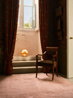 Mohair Sheared rug in Orchid styled beside an antique armchair