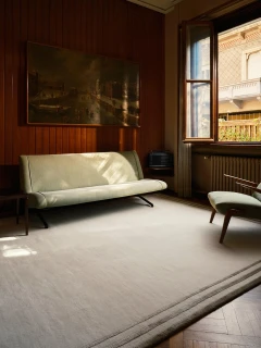 The Rug Company Portico rug, Birch colourway, styled in a wood-paneled living room with a cream sofa