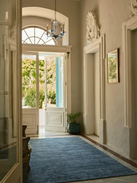 The Rug Company Vara rug, Aegean colourway, styled in an elegant interior