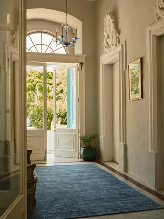 The Rug Company Vara rug, Aegean colourway, styled in an elegant interior