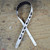 2.5" White Leather with Black Notes Guitar Strap
