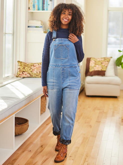 Woman wearing denim overalls lined with fleece.