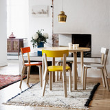 Artek Chair 69s around a table in a dining space