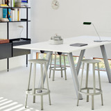 A HAY Boa High Table with stools around it