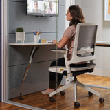 A person using an Orangebox Kirn Office Chair at a desk