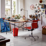 Vitra Eames EA 131 / EA 132 Chair in Fabric by an art desk Vitra Eames EA 131 / EA 132 Chair in Fabric by an art desk