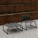 Mater Ocean Outdoor Lounge Low Table in Black next to a wall