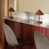 Mater Terra Portable Lamp in Coffee Rust Red on a bar Mater Terra Portable Lamp in Coffee Rust Red on a bar