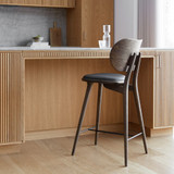 Mater High Backrest Stool next to a bar