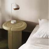 Mater Alder Side Table next to a bed