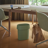 Muuto Reduce Paper Bin next to a table