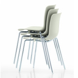 A stack of Vitra HAL RE Tube Stacking Chairs against a white background
