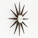 Vitra George Nelson Sunburst Clock in Walnut front left facing white sweep