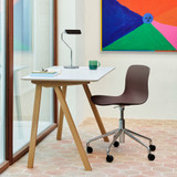 An Iron Black HAY Apex Table Lamp on a desk