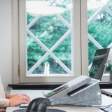 A person using a grey Bakker Ekhuizen Ergo-Top 320 Circular Laptop Stand