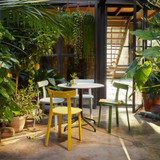 Various coloured Vitra APC Chair on a patio