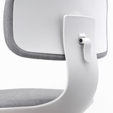 A close up of a Vitra Rookie Office Chair in grey against a white background