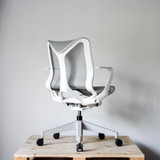 Herman Miller Cosm Low Back Office Chair Re-Lived in White raised by a pallet against a white wall