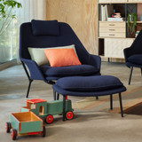Vitra Slow Chair Fabric in Dark Blue in a living room