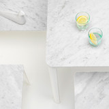 A close up of a Vitra Plate Coffee Table