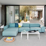 Vitra Plate Coffee Table next to a sofa