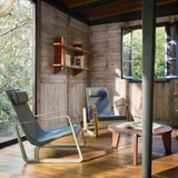 Vitra Gueridon Bas Coffee Table next to lounge chairs