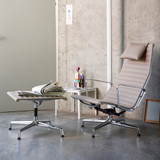 Vitra Eames Aluminium Group EA 124 Lounge Chair next to a coffee table
