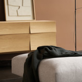 The Muuto Reflect Sideboard next to a sofa