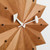 A close up of a Vitra Nelson Fan clock against a white background