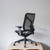 Herman Miller Cosm Medium Back Office Chair Re-Lived in Graphite rear angle