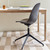 Upholstered Mater Eternity Swivel Chair next to a desk
