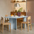 Muuto Re-Norm Table with chairs around it