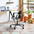 Vitra HAL RE Armchair Studio chair in Deep Black next to a desk, home office setting