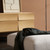 The Muuto Reflect Sideboard next to a sofa