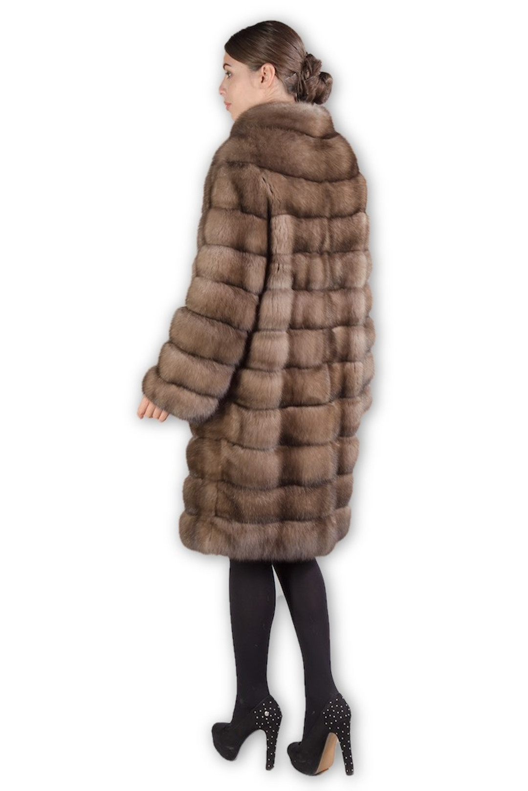 rear profile view of knee length light brown sable fur coat on mannequin