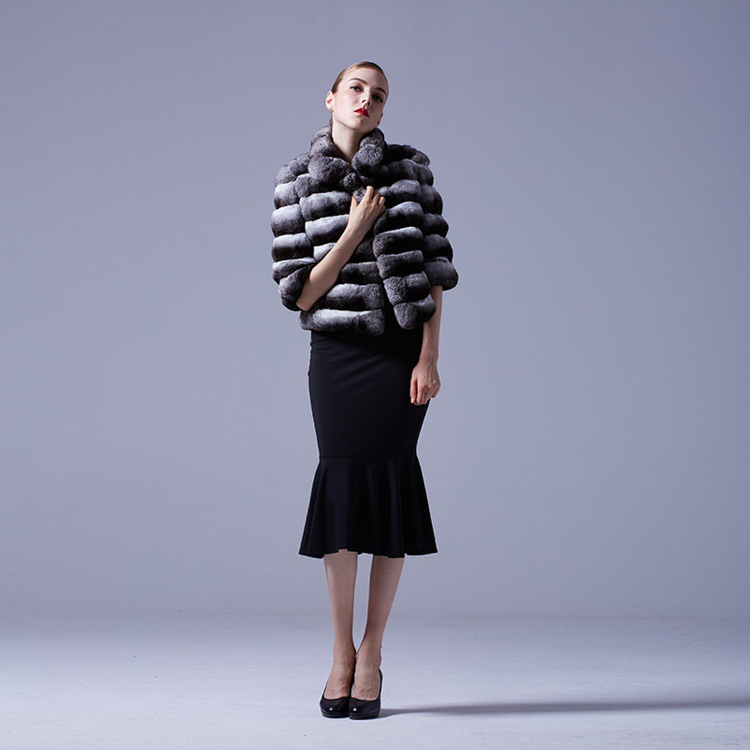 waist length  Chinchilla Jacket with elbow length sleeves full body view , matched with  black hourglass dress and black heels waist length  Chinchilla Jacket with elbow length sleeves full body view , matched with  black hourglass dress and black heels