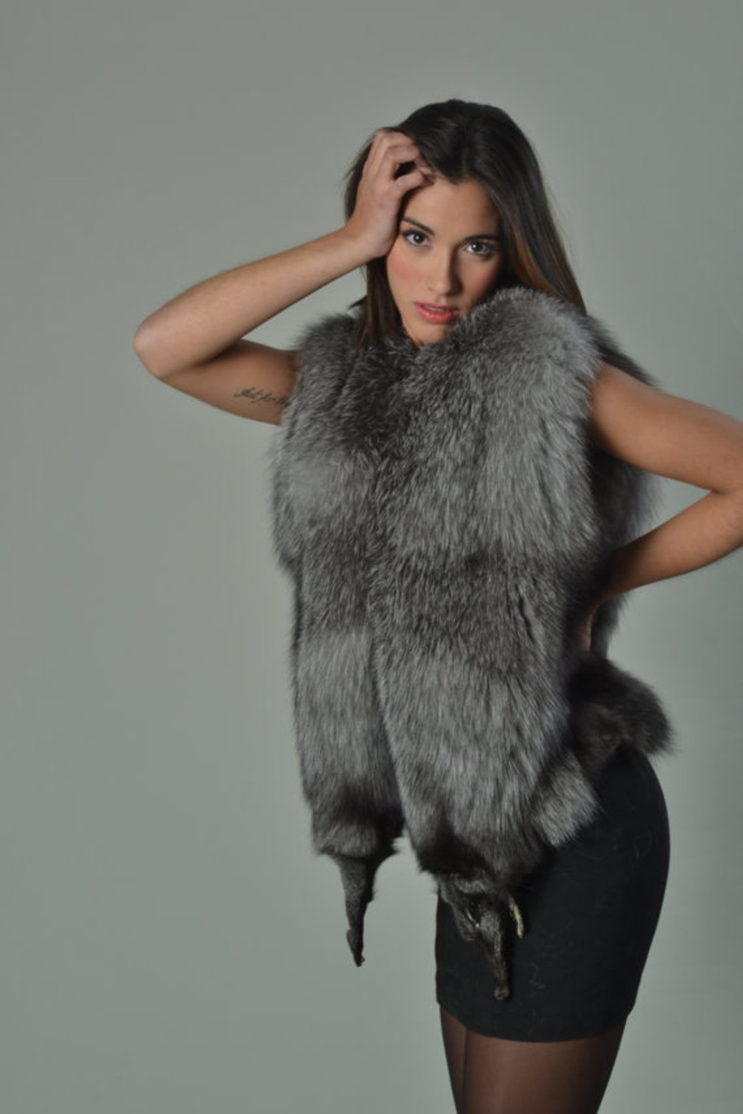 Blue Frost Fox Fur Vest Full Pelt high fashion posing model with tatoo Blue Frost Fox Fur Vest Full Pelt high fashion posing model with tatoo