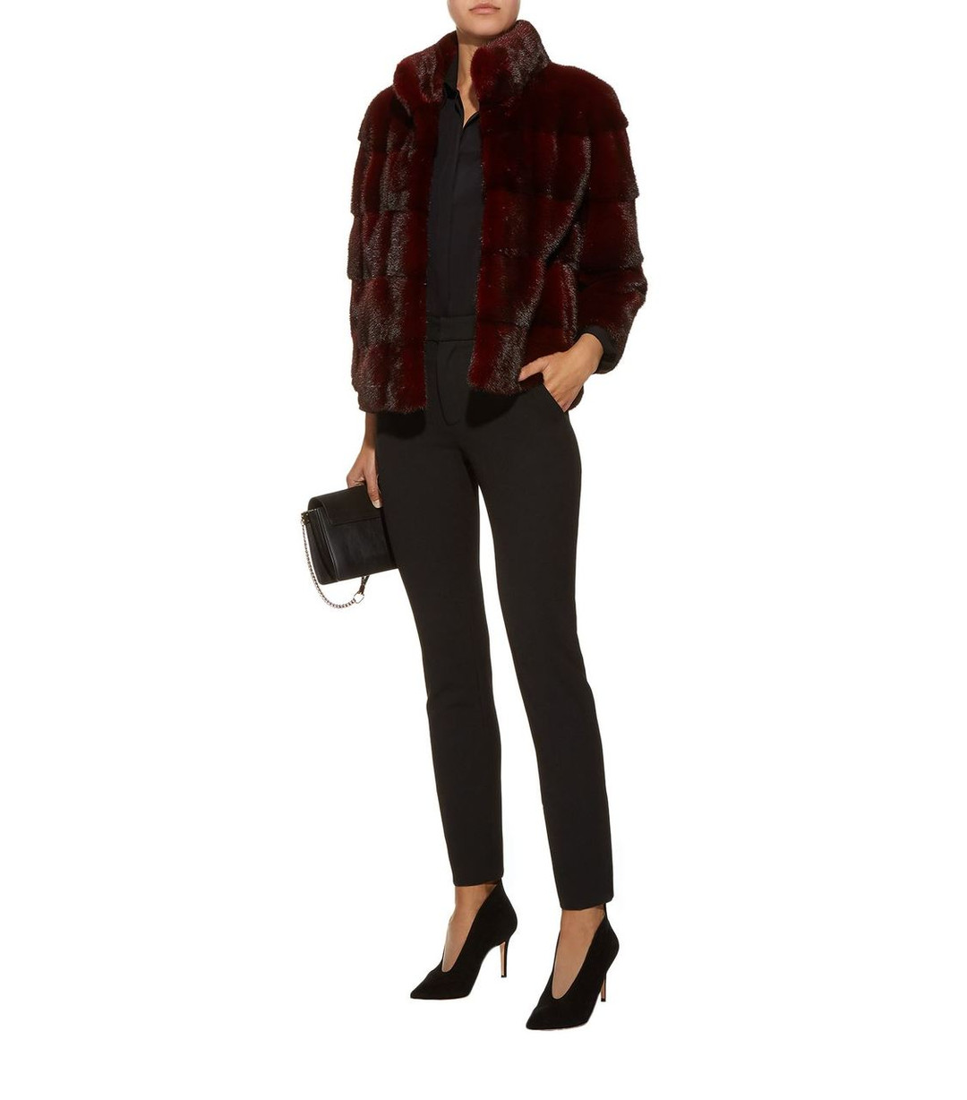 Burgundy Mink fur coat stand up collar  on model wearing black cotton pants , leather bag and leather high heels Burgundy Mink fur coat stand up collar  on model wearing black cotton pants , leather bag and leather high heels