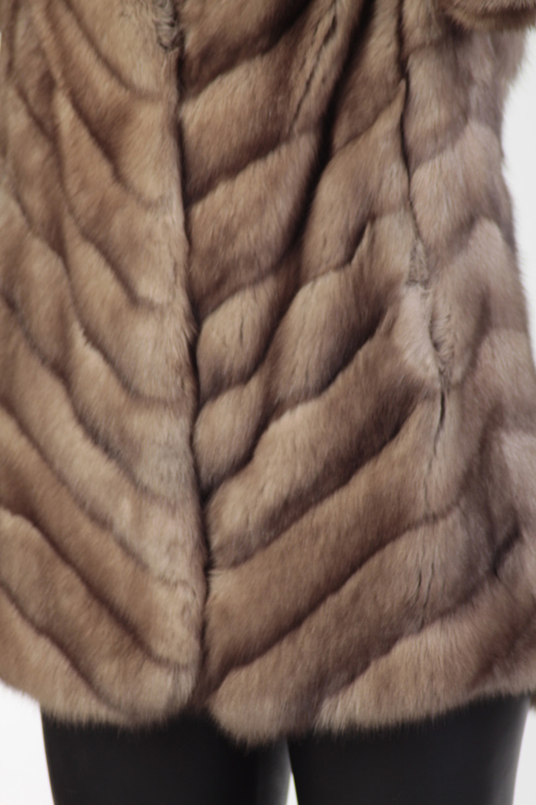 zoom vie on light brown sable fur coat with emphasis on stitching , color and texture zoom vie on light brown sable fur coat with emphasis on stitching , color and texture