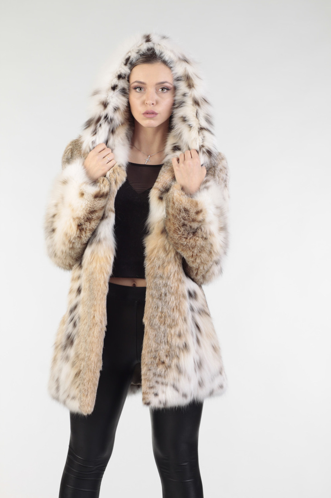 hooded lynx fur coat with skins sewn vertically on model with hood on view