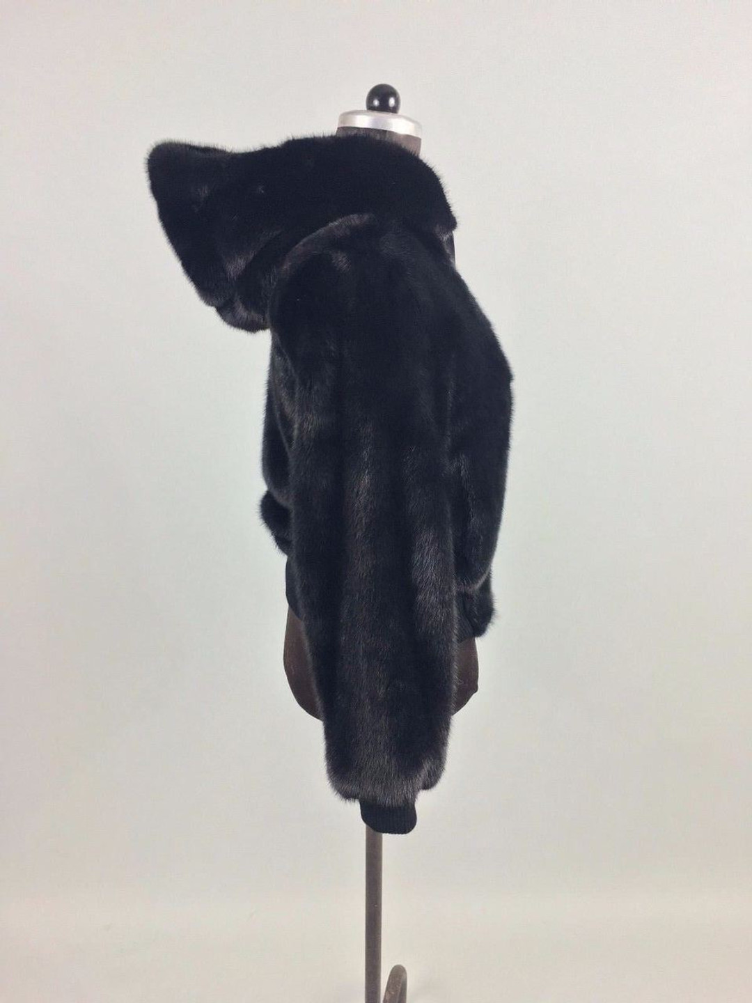men's black mink fur bomber jacket with hood and zipper right  lateral  view men's black mink fur bomber jacket with hood and zipper right  lateral  view