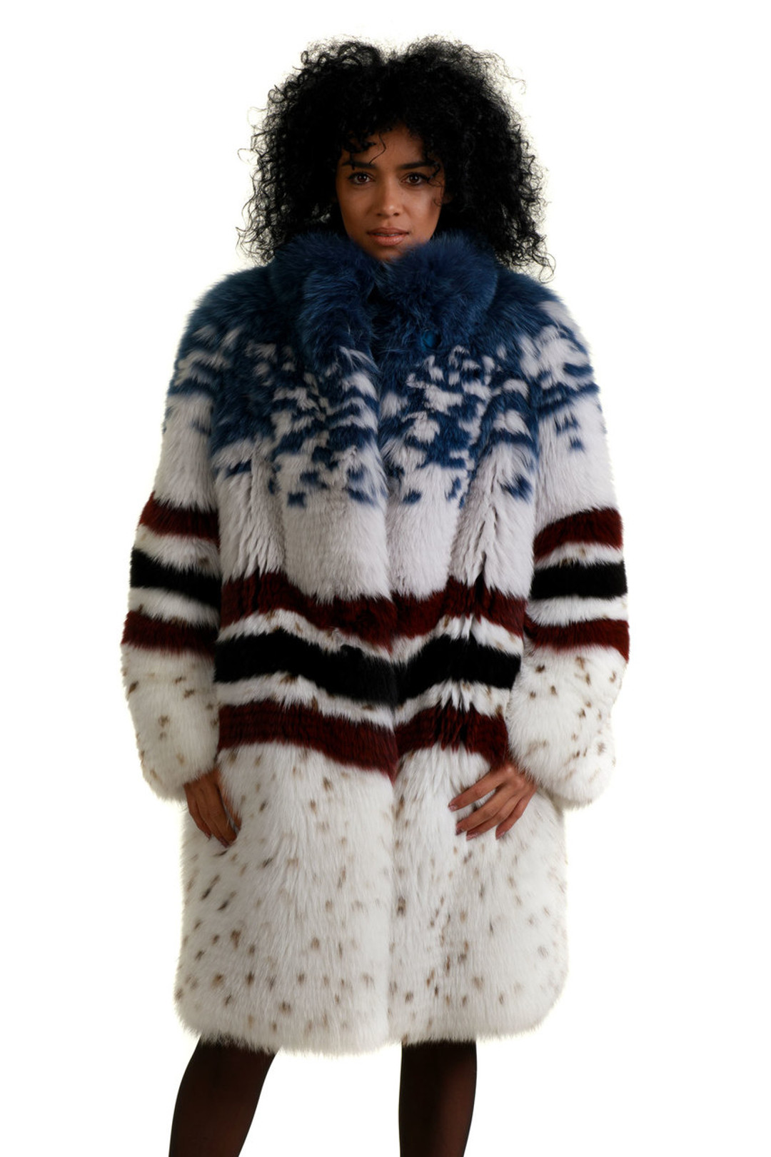 multicolor fox fur coat fully let out knee length  with white main body , wavy black and read stripes on middle part and blue covered top multicolor fox fur coat fully let out knee length  with white main body , wavy black and read stripes on middle part and blue covered top
